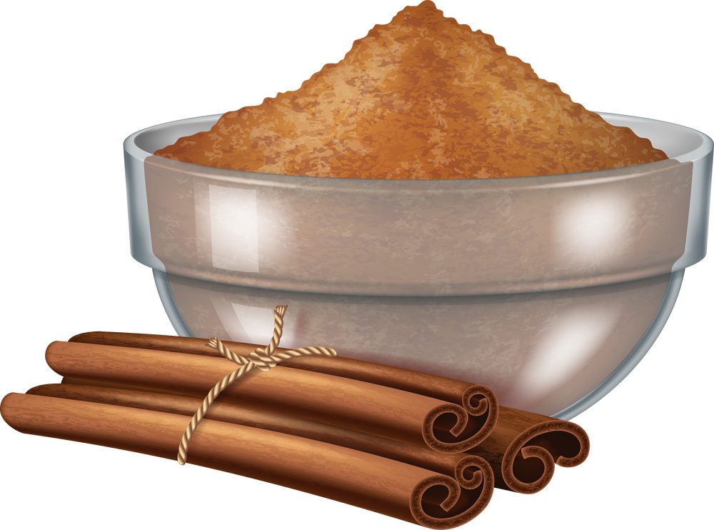 Glass bowl with cinnamon powder and cinnamon sticks